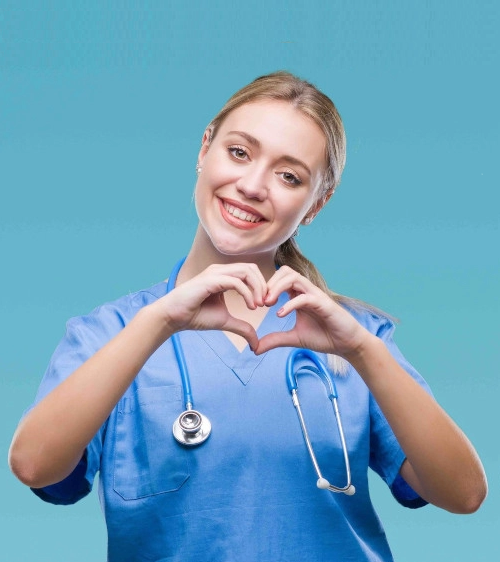 Smiling nurse making a heart shape with her hands