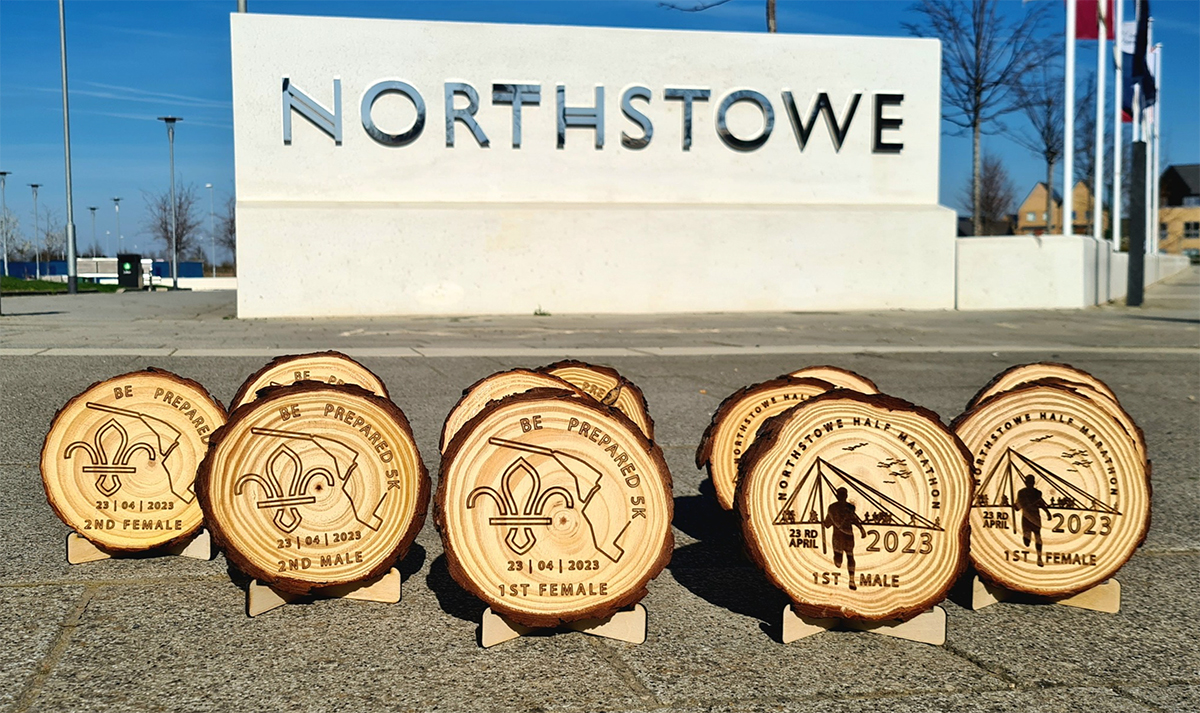 An image of the winners' and runners-up medals for the Northstowe Half Marathon and 5K races 2023