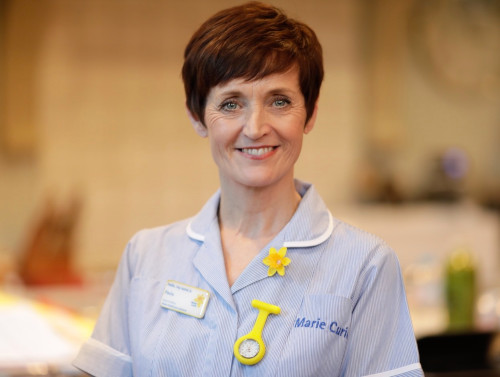 Nurse Paula smiling while in her Marie Curie outfit