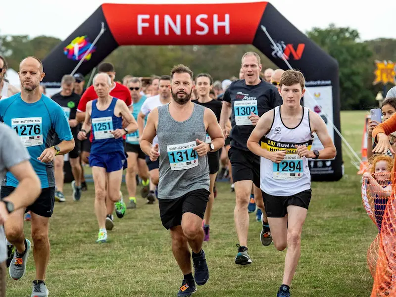 Children in a swimming pool during a competitive race.